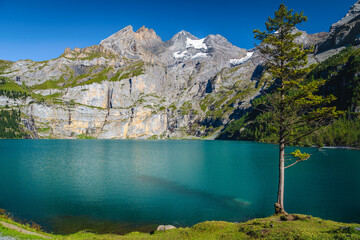 Naklejka na ściany i meble Oeschinensee alpine lake with beautiful high mountains and glaciers, Switzerland