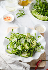green salad with cucumber and avocado