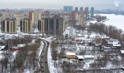 View of the residential area of the city and the Neva River from the top floor of a high-rise building. - Powered by Adobe