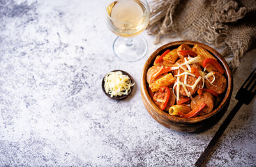 Meat sausage tomato sauce pasta in a bowl