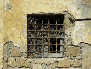 Detail of grilled window in the dilapidated old prison in the Island of Procida. Campania. Italy.