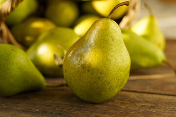 Pears on a wooden background. Fruit harvest. Autumn still life. Pear variety Bera Conference.