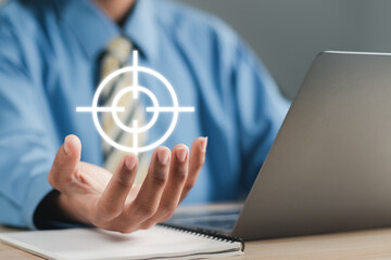 Target icon in businessman hand. Startup business. Goal Setting Ideas, Objectives and Investment Goal Ideas.