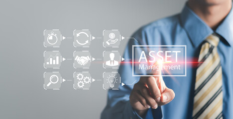 Businessman pressing on virtual screen and selecting asset management.