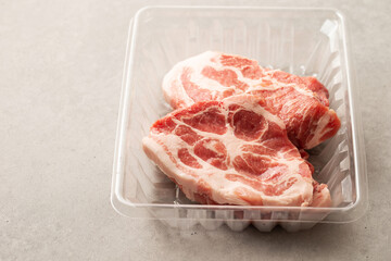 Fresh neck meat in packaging container