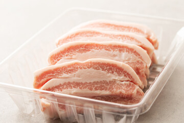 Fresh neck meat in packaging container