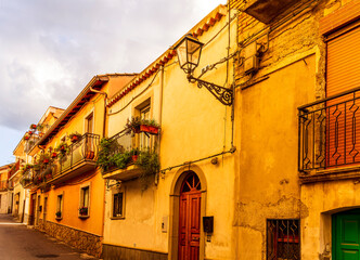 Fototapeta na wymiar old mediterranean mountain dense town with yellow houses in evening light, vintage european village