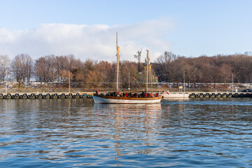 Wooden yacht at the exit from the port of Gdansk
