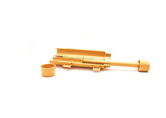 Open loading tray with plunger long press screw assembly of brown plastic rice bazooka sushi roller making tool isolated on white background