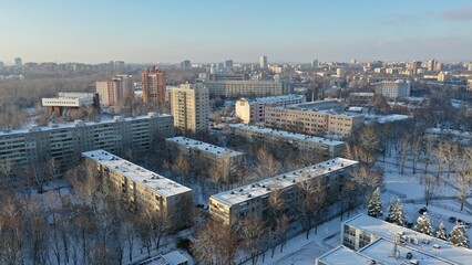 Fototapeta premium Vostok microdistrict in Minsk in winter. Sleeping areas of the capital of Belarus in the snow. Snow-covered Minsk in winter. Aerial photography of Minsk from above. Eastern Europe.