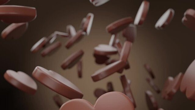 Realistic 3D animation of the milk heart shaped chocolate pieces falling from the top. High quality 4k rendered footage
