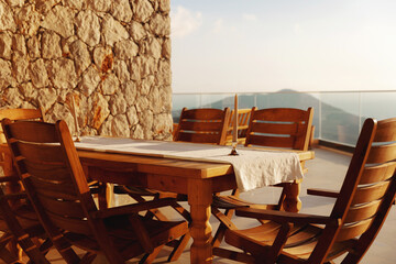 Set of furniture for attic, brown wooden chairs and table in outside garden or balcony for relaxation