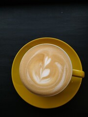A cup of coffee latte art to cheer your day up