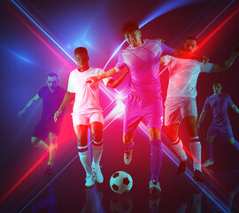 Soccer players play with soccerball in a match