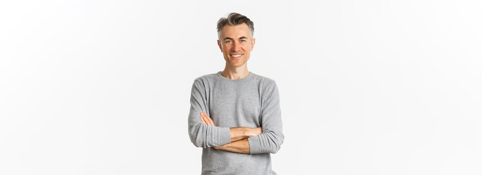 Image Of Successful And Confident Middle-aged Man, Cross Arms On Chest And Smiling Satisfied, Standing Determined Over White Background