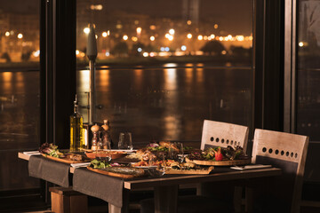 Dining table in restaurant by the sea