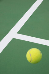 Tennis ball on green court
