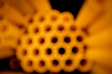 Background of the orange plastic pipes in stacked