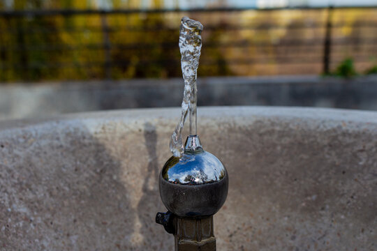 Water on snall metail fountain