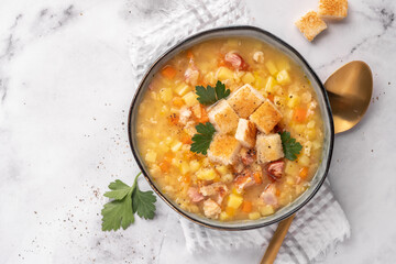 Lentil pea soup garnish with ham and pork ribs