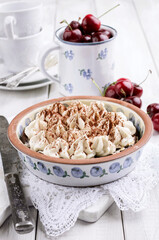 Traditional Swiss cherry pie with meringue topping served as close-up in a baking form