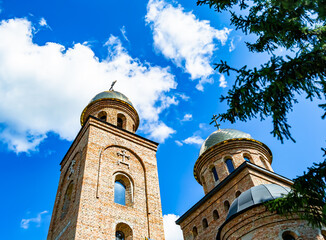 Christian church cross in high steeple tower for prayer
