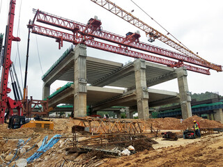 SELANGOR, MALAYSIA -JULY 6, 2022: An elevated road is under construction. Reinforced concrete is used for the structure. Construction is done in stages according to the sequence of works.