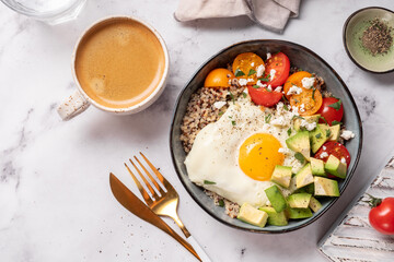 Keto diet plate quinoa, avocado, egg and tomatoes. Healthy food, ketogenic diet