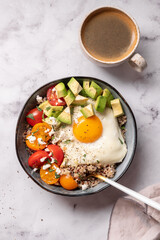 Keto diet plate quinoa, avocado, egg and tomatoes. Healthy food, ketogenic diet