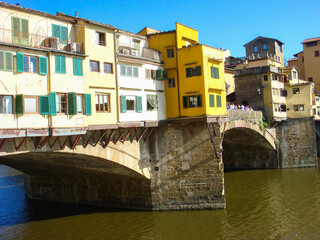 Fototapeta na wymiar Close-up on bridge and river on the sunny day. Florence. Italy.
