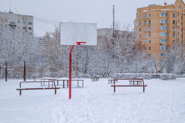 Basketball court on the territory of a comprehensive school in winter. Balashikha, Russia