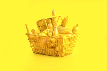 Yellow shopping basket with yellowfood on yellow background. Food buyng online and delivery.