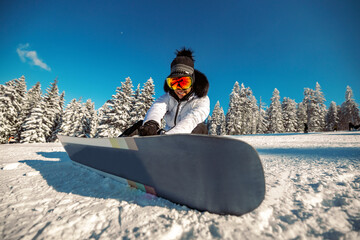 Portrait of cheerful snowboarder