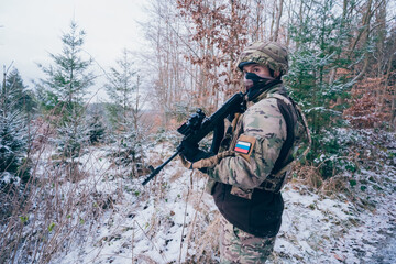 Russian soldier in occupied territory. Soldier patrols with an assault rifle. 