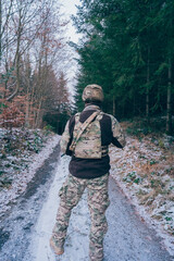 Russian soldier in occupied territory. Soldier patrols with an assault rifle. 