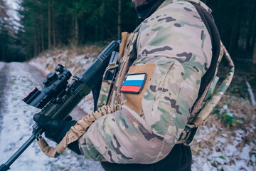 Russian soldier in occupied territory. Soldier patrols with an assault rifle. 
