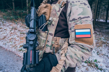 Russian soldier patrols the forest