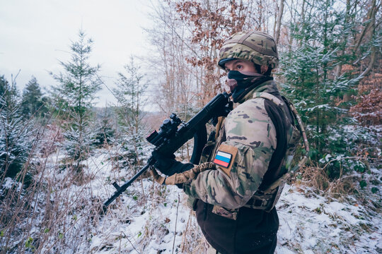Russian soldier in occupied territory. Soldier patrols with an assault rifle. 