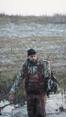 Naklejka premium hunting by the creek in the forest. And hunting birds. Hunter hunting at sunrise