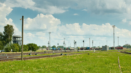 Fototapeta na wymiar RIGA, LATVIA-JULY 2, 2022: railway, in the photo a large marshalling yard, railway wagons,railway tanks, semaphores and tracks