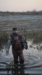 Naklejka premium hunting by the creek in the forest. And hunting birds. Hunter hunting at sunrise