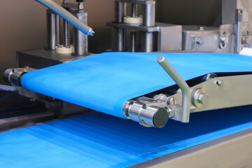 Conveyor Belt Food.Factory for the production of food. Production line with packaging. Food products  in plastic packaging on the conveyor. food production concept