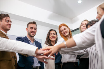 Teamwork Deal Cooperation Partnership business people giving hi-five before work in the office, touch hands for unity group to succuss business. - 553006484