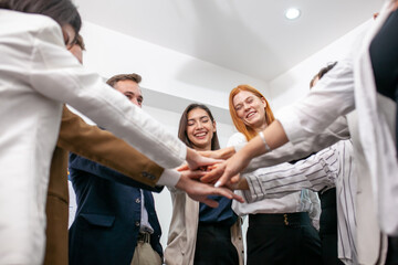 Teamwork Deal Cooperation Partnership business people giving hi-five before work in the office, touch hands for unity group to succuss business. - 553006494