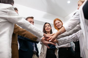 Teamwork Deal Cooperation Partnership business people giving hi-five before work in the office, touch hands for unity group to succuss business. - 553006498