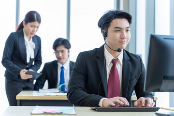 A group of young Asian businessmen Talking and planning work happily and have fun. at the company's office