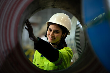 Portrait of a heavy equipment female engineer from a huge industry