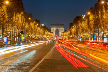 Fototapeta na wymiar Paris - France,France - 12 08 2022: View of the Arc-De-Triomphe and Avenue des Champs Elysees with Christmas lights