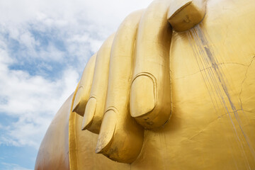 Fingers and hands of golden big buddha statue