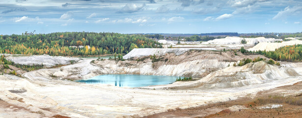 Amazing kaoline quarry, texture of kaolin quarry, beautiful lake, view of industrial clay hills, environment after mining